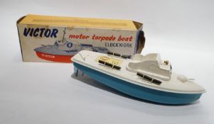 Sutcliffe tinplate clockwork Victor Motor Torpedo Boat, with blue hull, white deck and