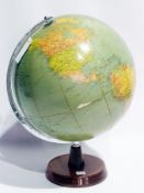 A Phillips Challenge globe on a revolving stand with circular wooden base