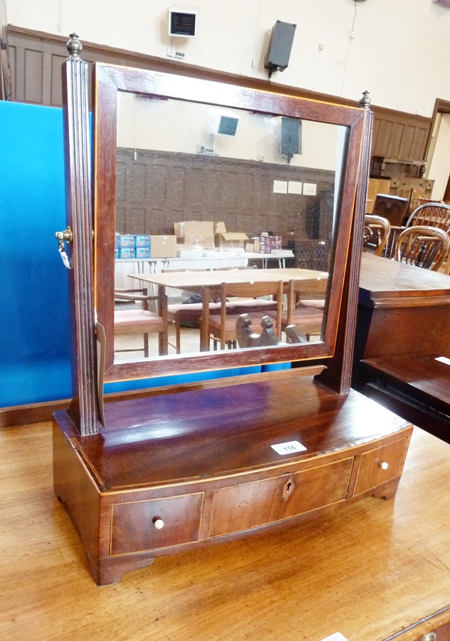 Early 19th century mahogany toilet mirror, the rectangular plate on reeded supports with brass