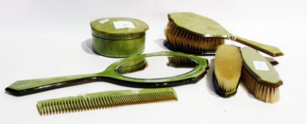 American green veined celluloid dressing table set comprising hand mirror, comb, various brushes,