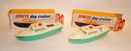 Sutcliffe tinplate clockwork Sprite Day Cruiser with green hull, boxed and another, boxed (2)