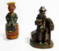 Corkscrew bottle opener in the form of a jolly sailor seated on a barrel  and a Black Forest carving