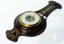 Oak cased aneroid barometer with thermometer plaque above the circular dial