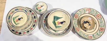 Pair Quimper plates each painted to the centre with head and shoulders of man wearing hat with