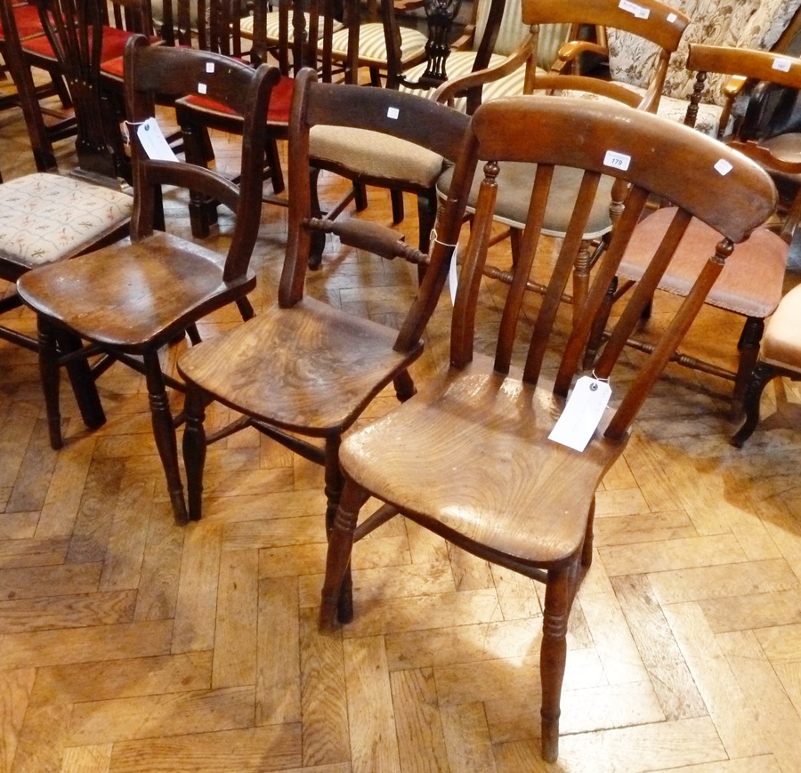 A stained oak kitchen chair, with slatback, another and a stained wood kitchen chair (3)