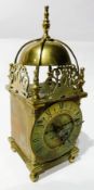 20th century brass lantern style clock with engraved and pierced dolphin pediment, French