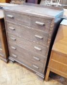 Twentieth century oak chest of five long drawers raised on ogee bracket feet, width 77cms