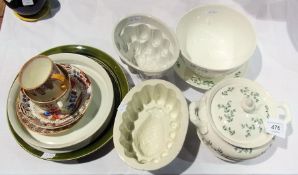 Quantity of decorative items to include jelly moulds, two teacups and saucers, quantity of plates