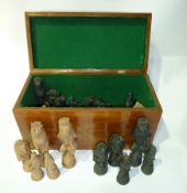 Composition set of chess pieces, in the form of ornate animals, in figured wood case