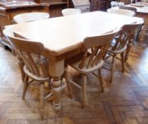 A Victorian style pine rectangular top dining table, on turned legs, length 183cms together with a