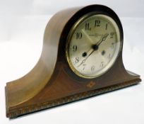 Polished wood Westminster Clock Company mantle clock in Napoleon's hat shaped case with stringing