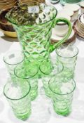 A 20th century green coloured glass jug, with dimple decoration and a set of six matching