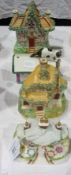 Two Staffordshire pottery cottages, Coalport Keepers Cottage, and Fairing type trinket box, cat on