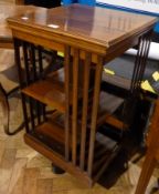 An Edwardian mahogany revolving bookcase, with two shelves and open splat sides, on castors, width