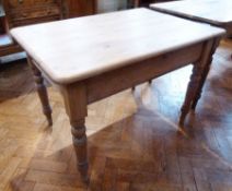A Victorian pine rectangular top kitchen table with frieze drawer on turned legs, length 106cms