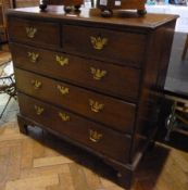 Georgian mahogany chest of two short and three long drawers raised on bracket feet, plate brass