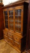 Twentieth century oak glazed bookcase, the upper section with leaded light doors enclosing