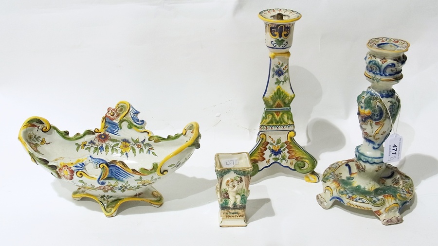 A Rouen Faience porcelain candlestick, another similar and a shaped bowl (af) and a Capodimonte