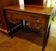 A Georgian mahogany lowboy with moulded edge top, long frieze drawer, with two short drawers and