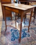 An oak square occasional table, with single frieze drawer (handle missing), on tapering splayed