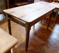 An old pine rectangular top kitchen table on turned tapering legs, length 126cms