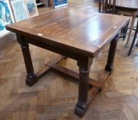 Twentieth century oak drawleaf dining table, on gun barrel turned legs united by stretchers, width
