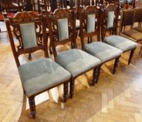 Set of four Victorian mahogany dining chairs, with carved, pierced back, green upholstered panel,
