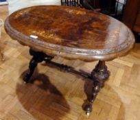 A Victorian burr walnut and floral satinwood inlaid oval top sidetable with floral carved border,