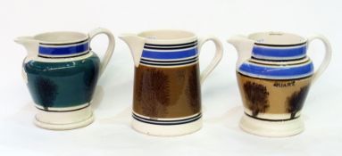 Three 19th century mochaware jugs, 16cm high (af)