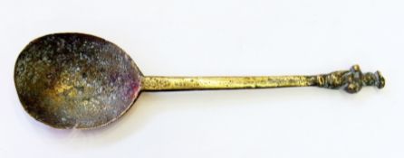 A brass spoon, with figure to finial (af)