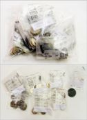 A quantity of foreign and commonwealth coins, identified by country in separate bags with a bronze