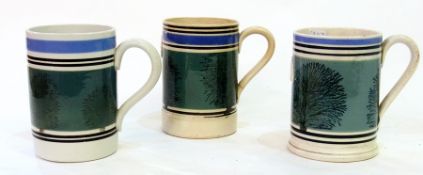 Three 19th century mochaware tankards, 12.5cm high (af)