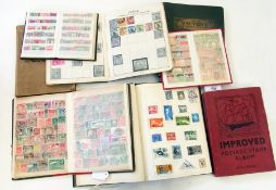 Quantity of worldwide stamps, in red postage stamp album, the marble postage stamp album, the