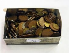 Assorted coins in tin