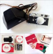 A Leica M4 chrome camera body no. 1229 963, in a stitched leather case, original box, instruction