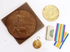 World War I death plaque for John Cleaver Bishop, a World War I service medal for 4802 Pte. J. C.