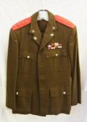 1970's army uniform for Capt.D.P.Hodges, jacket with red epaulets, and gold stars with badges and