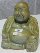 Oriental porcelain model of seated Buddha with celadon glaze