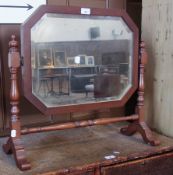 Mahogany octagonal swing framed mirror, bevelled edge, on turned support on cabriole legs, 58cm wide