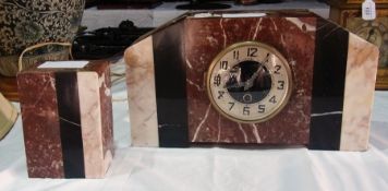 Art Deco marble clock garniture, the central time piece in an angular rectangular brown, white and