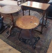 An oak tilt top circular tripod occasional table, on capriole supports, a two tier circular tripod