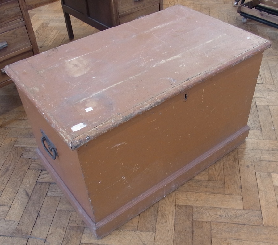 A pine painted brown trunk, with hinged lid, 170cm wide