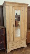 Old pine single pine wardrobe with mirror panel door, brass drop handle, enclosing hanging space