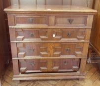 Oak revived Stuart style chest of four long graduated drawers with geometric moulded fronts, foliate