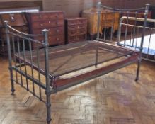 Brass finish single bedstead, with iron frame, rail ends, on castors