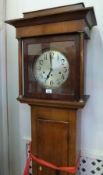 18th/early 19th century longcase clock, with circular columns to hood, plain dial, inlaid escutcheon