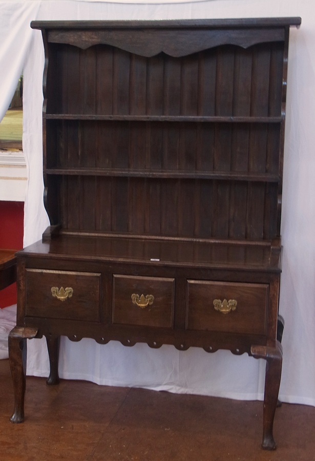 Antique oak dresser with two shelves above, three short drawers below with brass swan neck handles