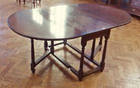 20th century oak gateleg table, on turned supports united by stretchers, 82cm wide