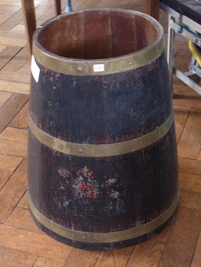 An old oak barrel with brass mounts, with worn coat of arms to front, 53cm high