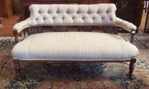 Edwardian stained wooden buttonback open arm settee, on turned, tapering supports, brass casters